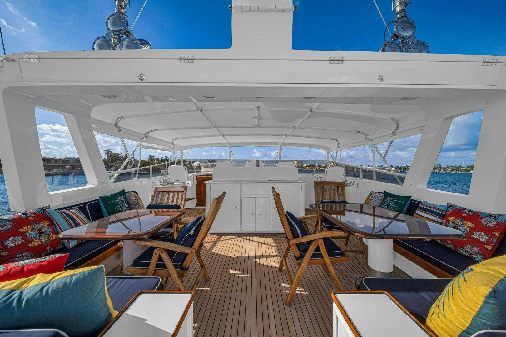 inside of a building with tables and chairs aboard INEVITABLE Yacht for Sale