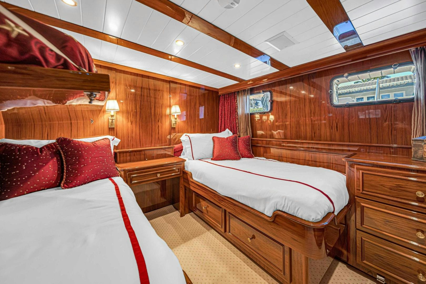 a room with two beds aboard INEVITABLE Yacht for Sale