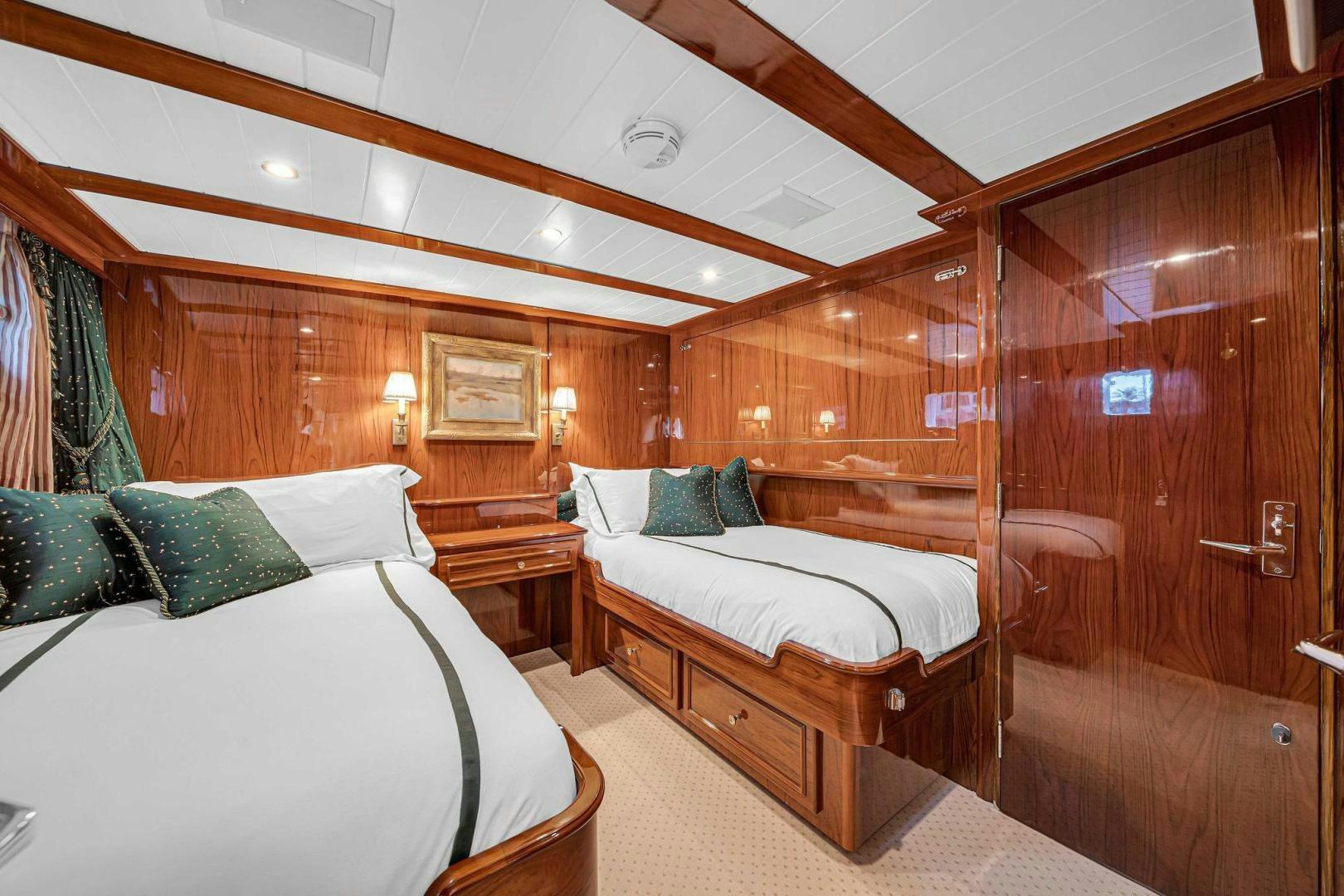 a room with two beds aboard INEVITABLE Yacht for Sale