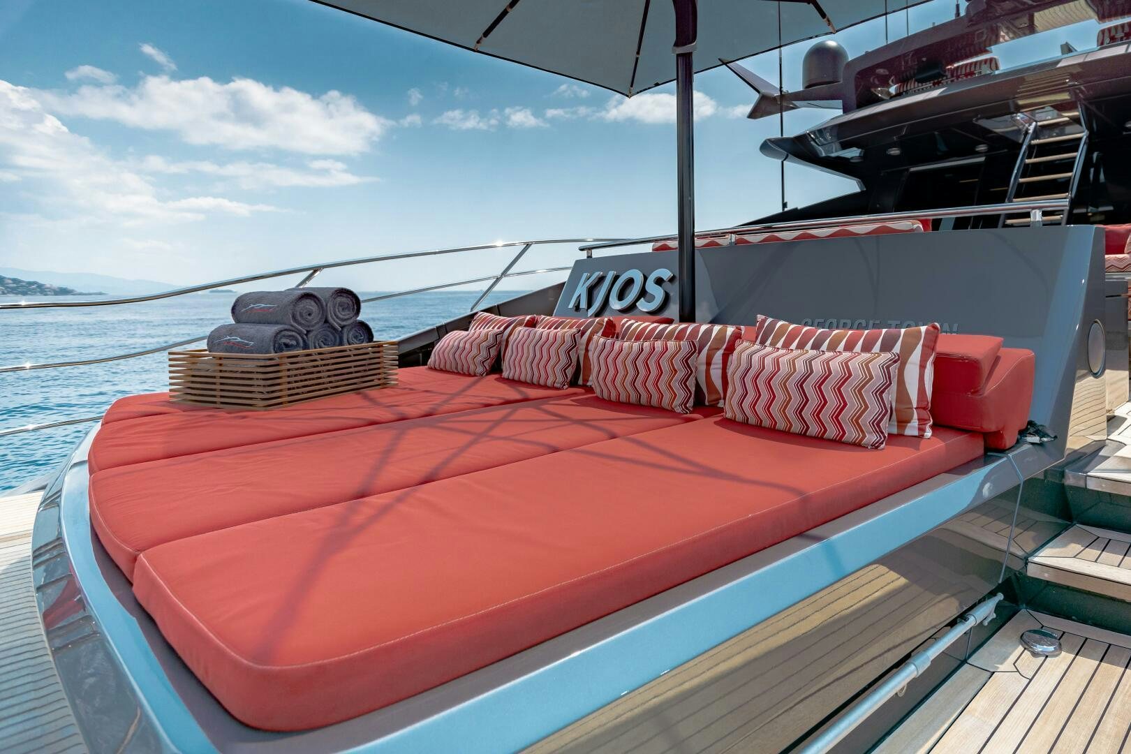 a boat with pillows on the deck aboard KJOS Yacht for Sale