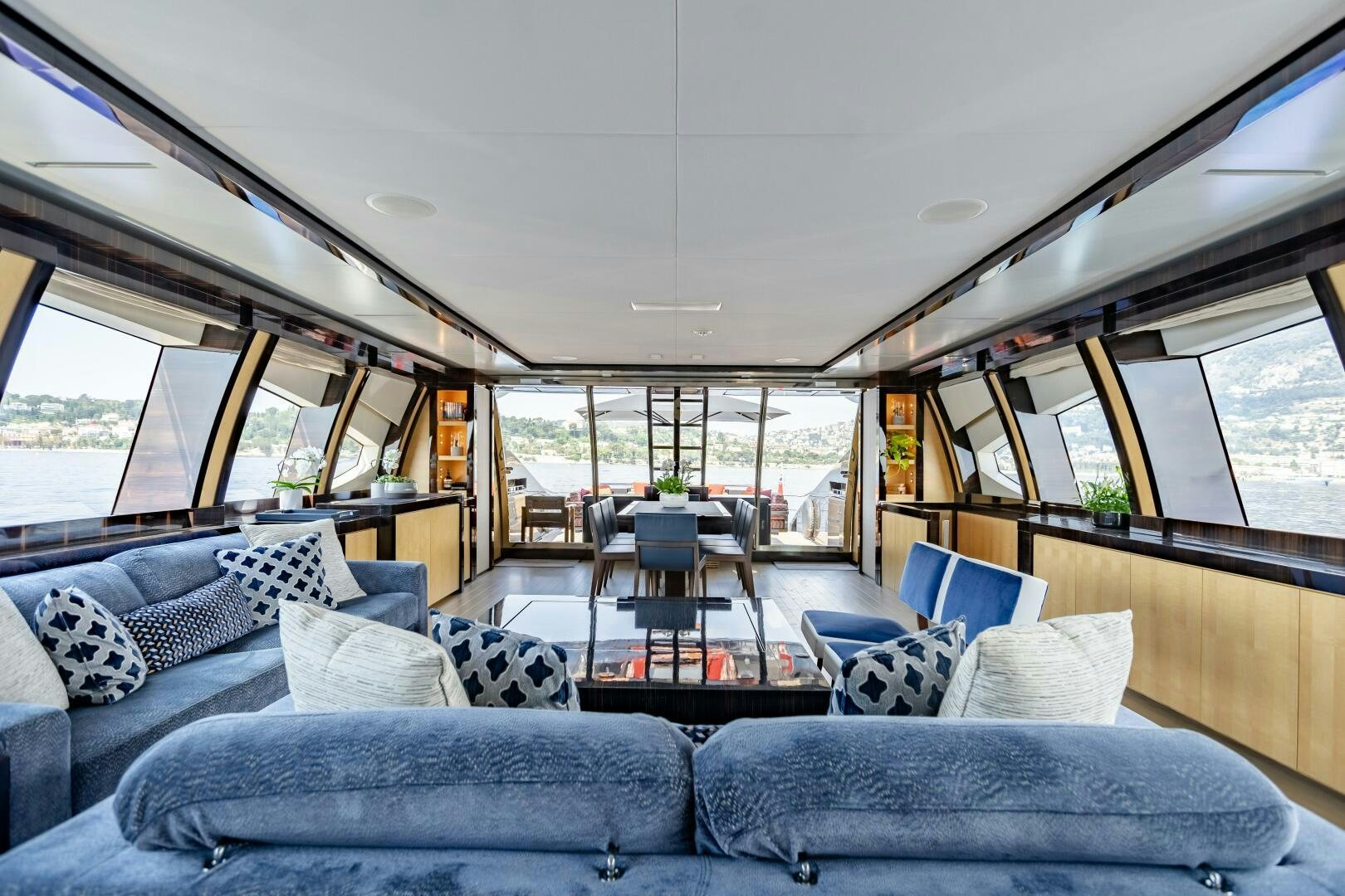 a living room with a large window aboard KJOS Yacht for Sale