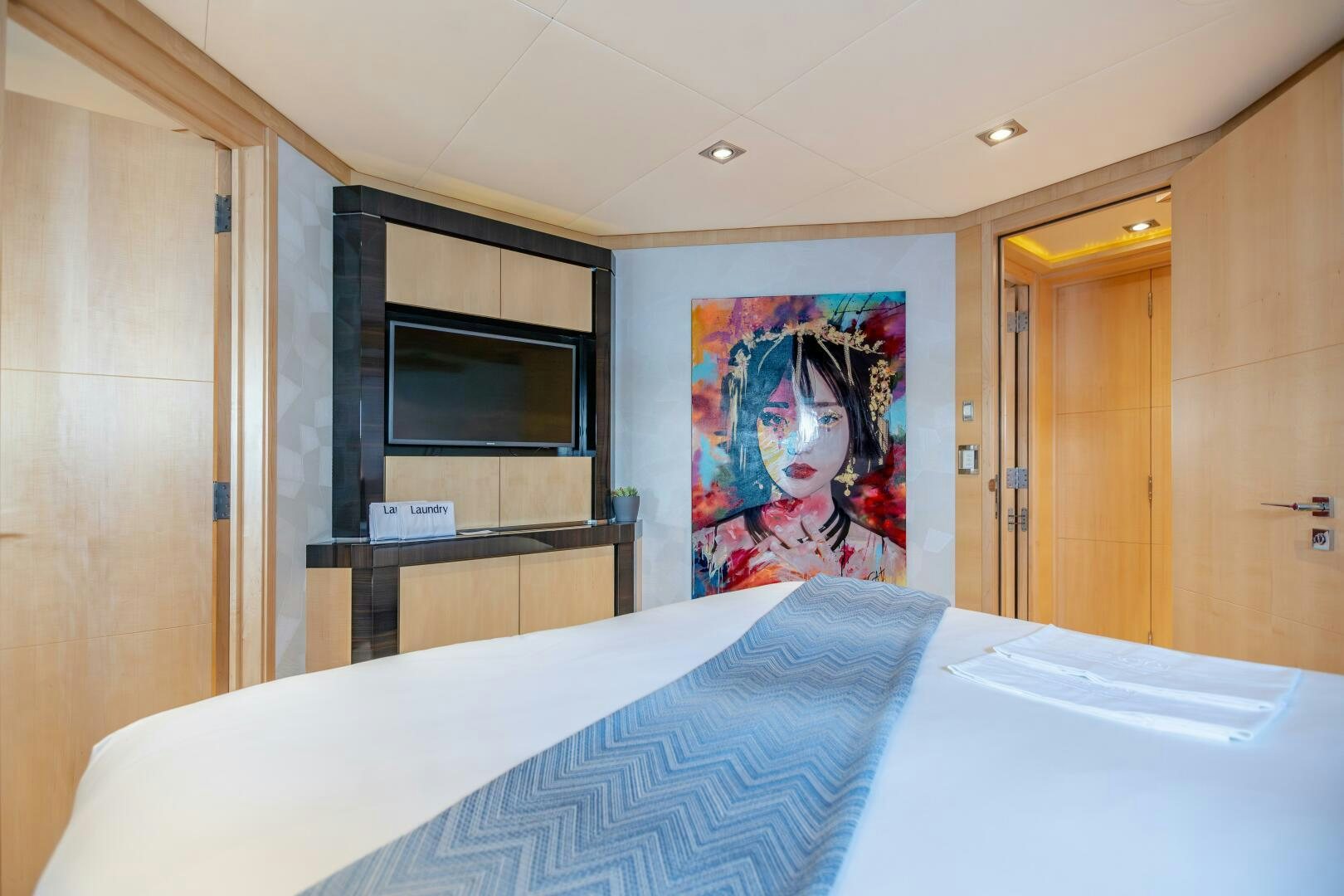 a bed in a room aboard KJOS Yacht for Sale