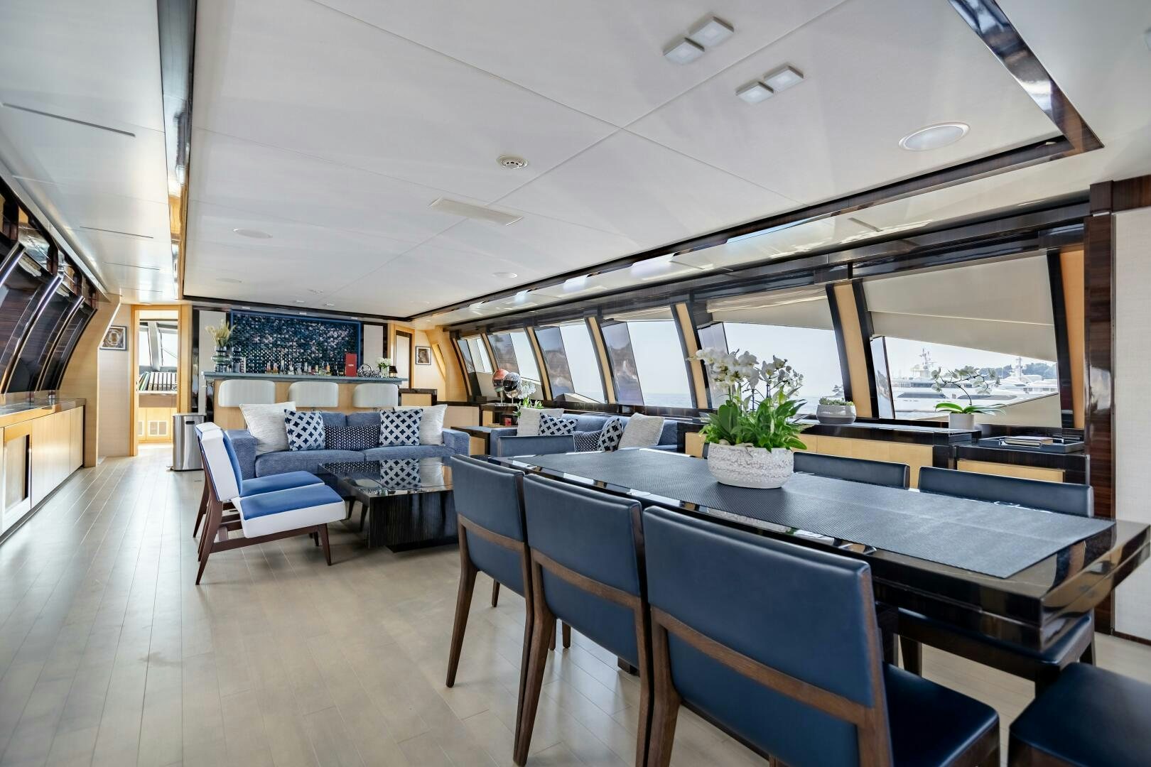 a large open kitchen and dining area aboard KJOS Yacht for Sale