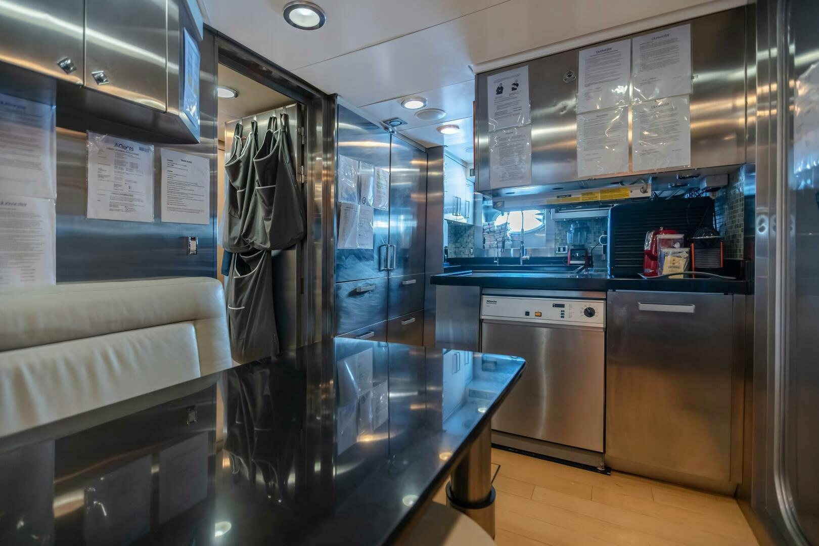 a large kitchen with glass walls aboard KJOS Yacht for Sale