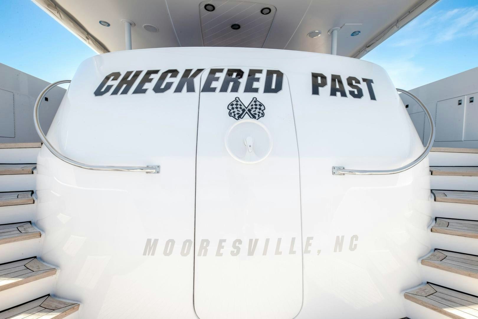 a white machine with a logo aboard CHECKERED PAST Yacht for Sale