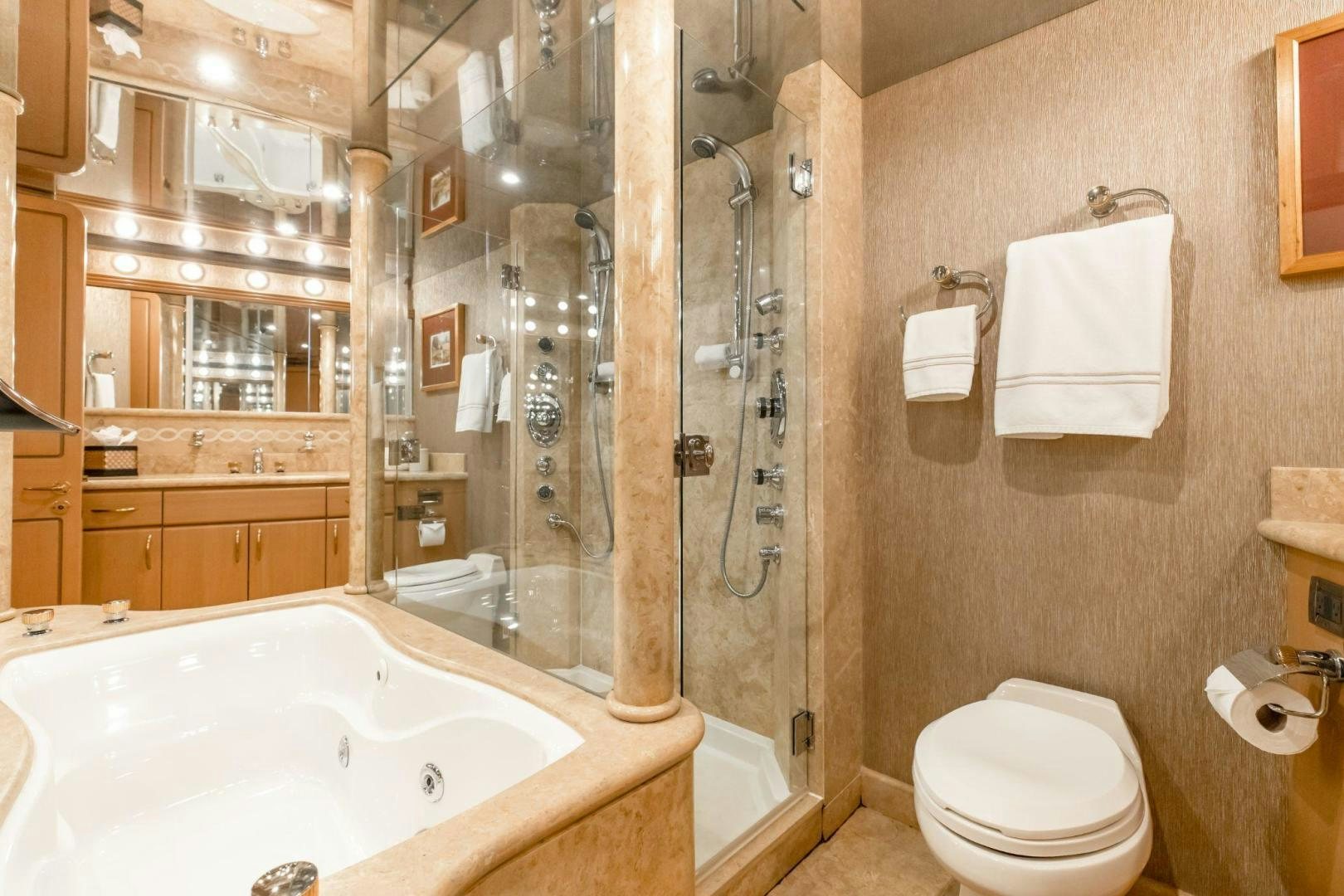 a bathroom with a glass shower aboard CHECKERED PAST Yacht for Sale