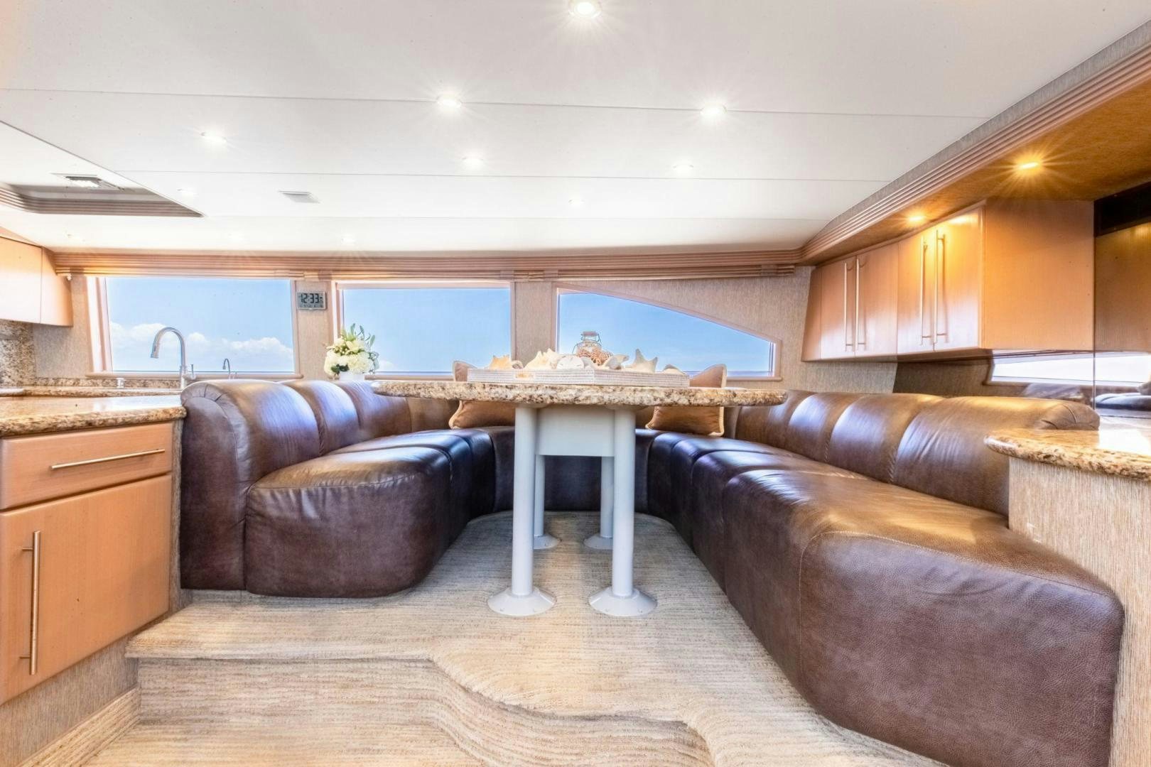 a living room with a fireplace aboard CHECKERED PAST Yacht for Sale