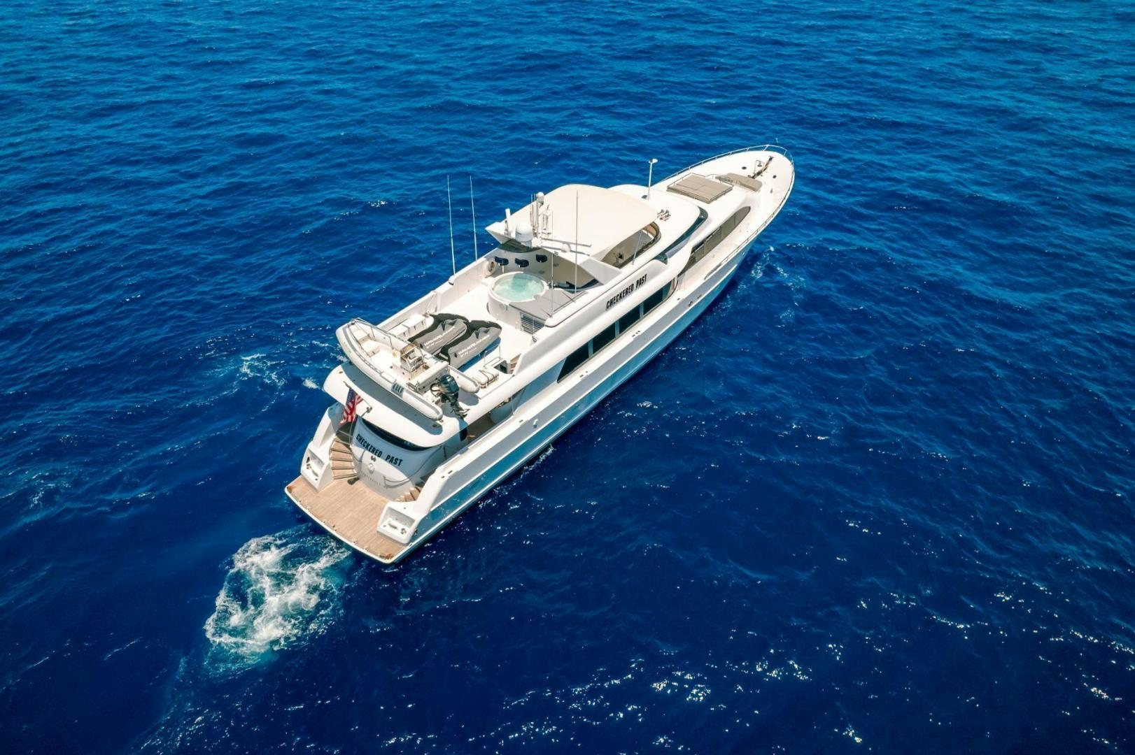 a boat in the water aboard CHECKERED PAST Yacht for Sale