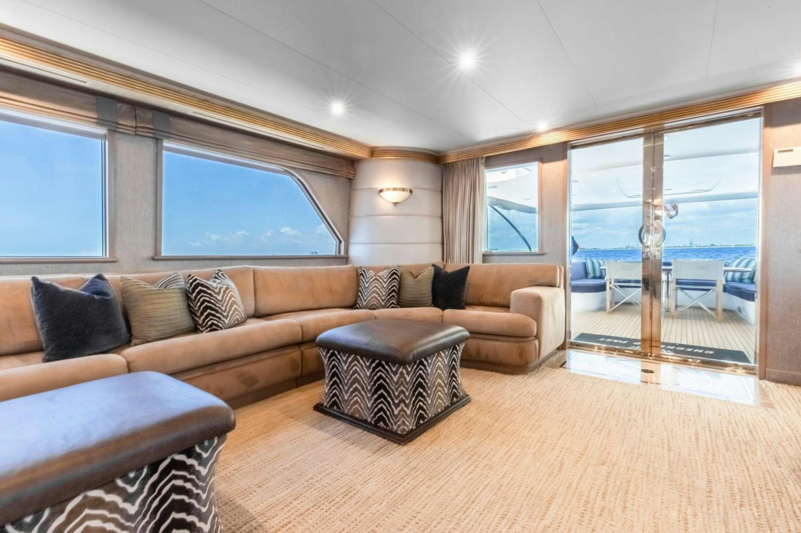 a living room with a large window aboard CHECKERED PAST Yacht for Sale