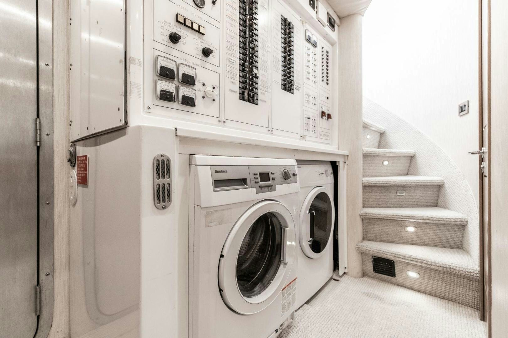 a white laundry machine aboard CHECKERED PAST Yacht for Sale