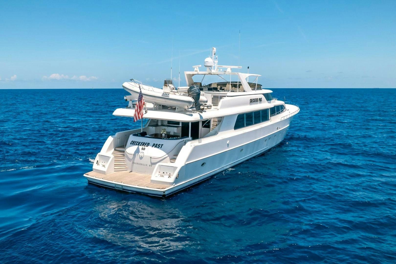 a boat in the water aboard CHECKERED PAST Yacht for Sale