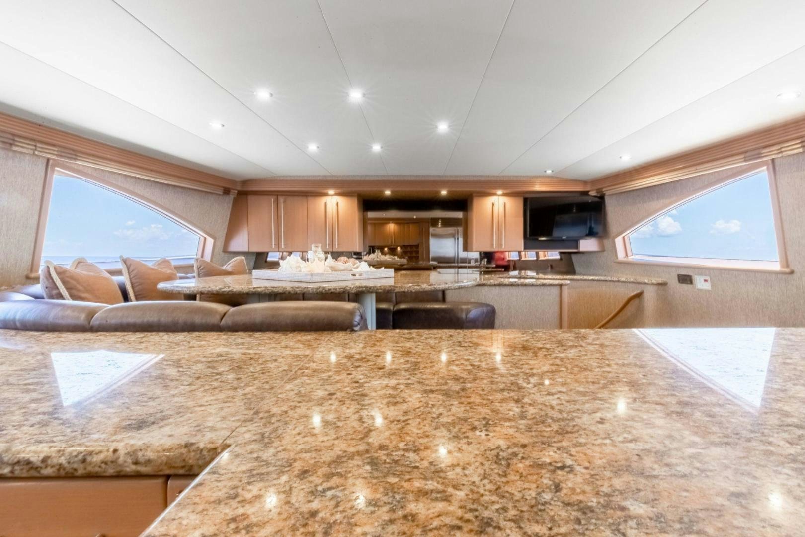 a large living room with a large floor aboard CHECKERED PAST Yacht for Sale
