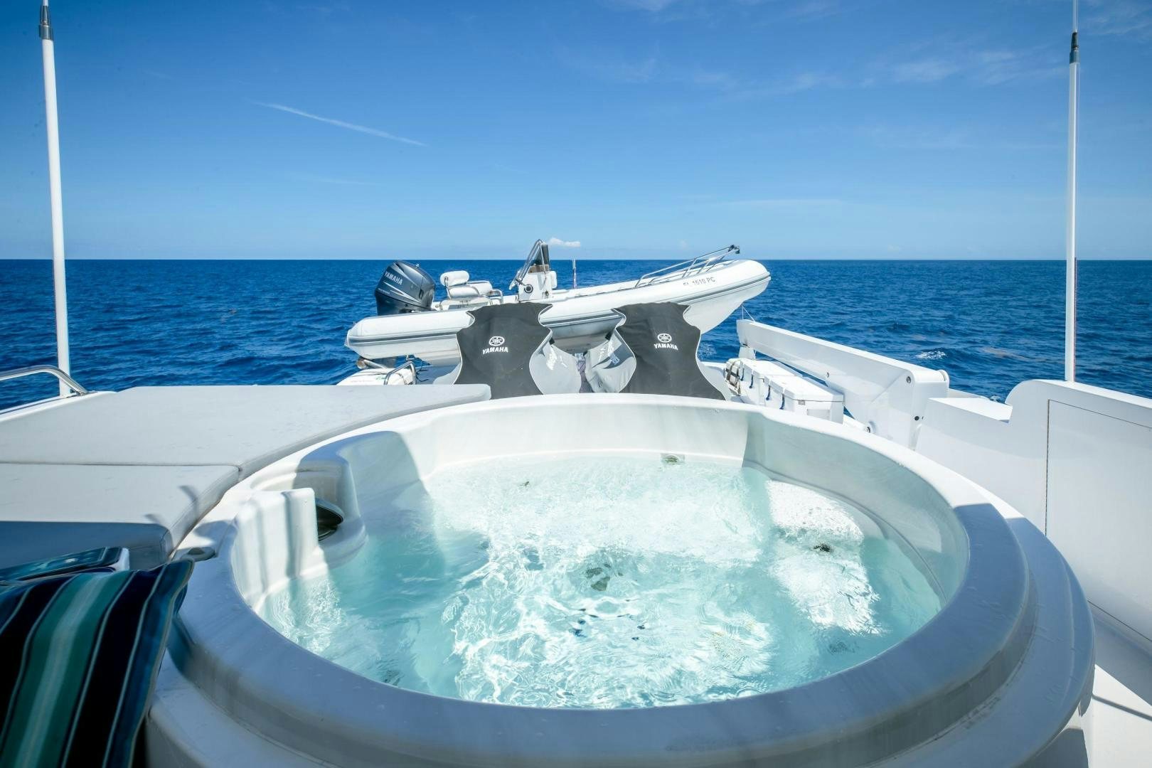a boat in the water aboard CHECKERED PAST Yacht for Sale