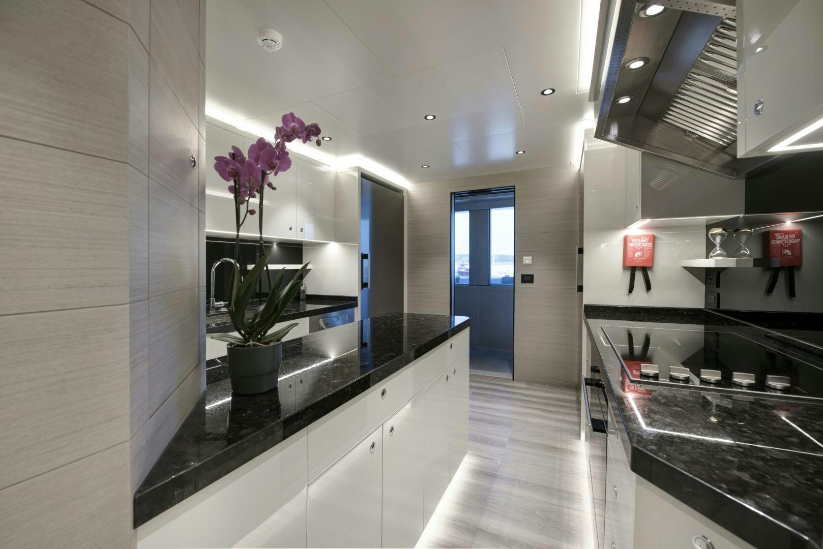 a kitchen with a countertop aboard PICCOLO Yacht for Sale