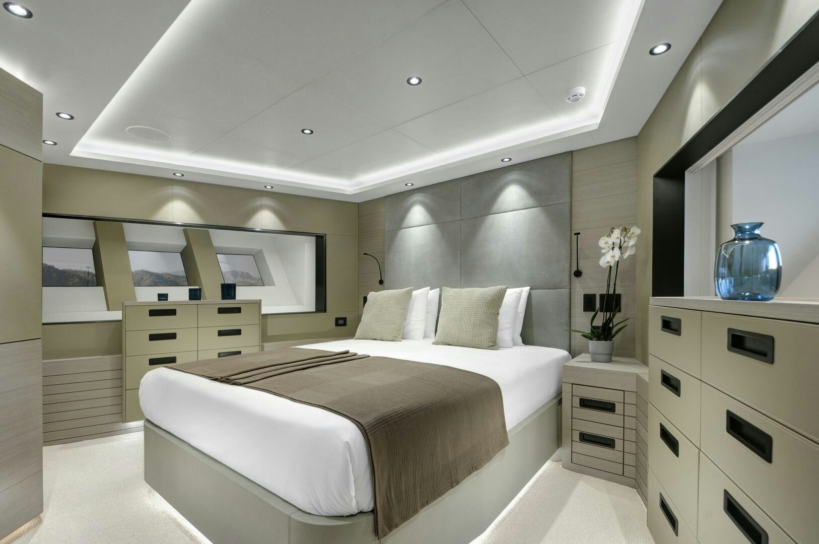 a room with a bed and cabinets aboard PICCOLO Yacht for Sale