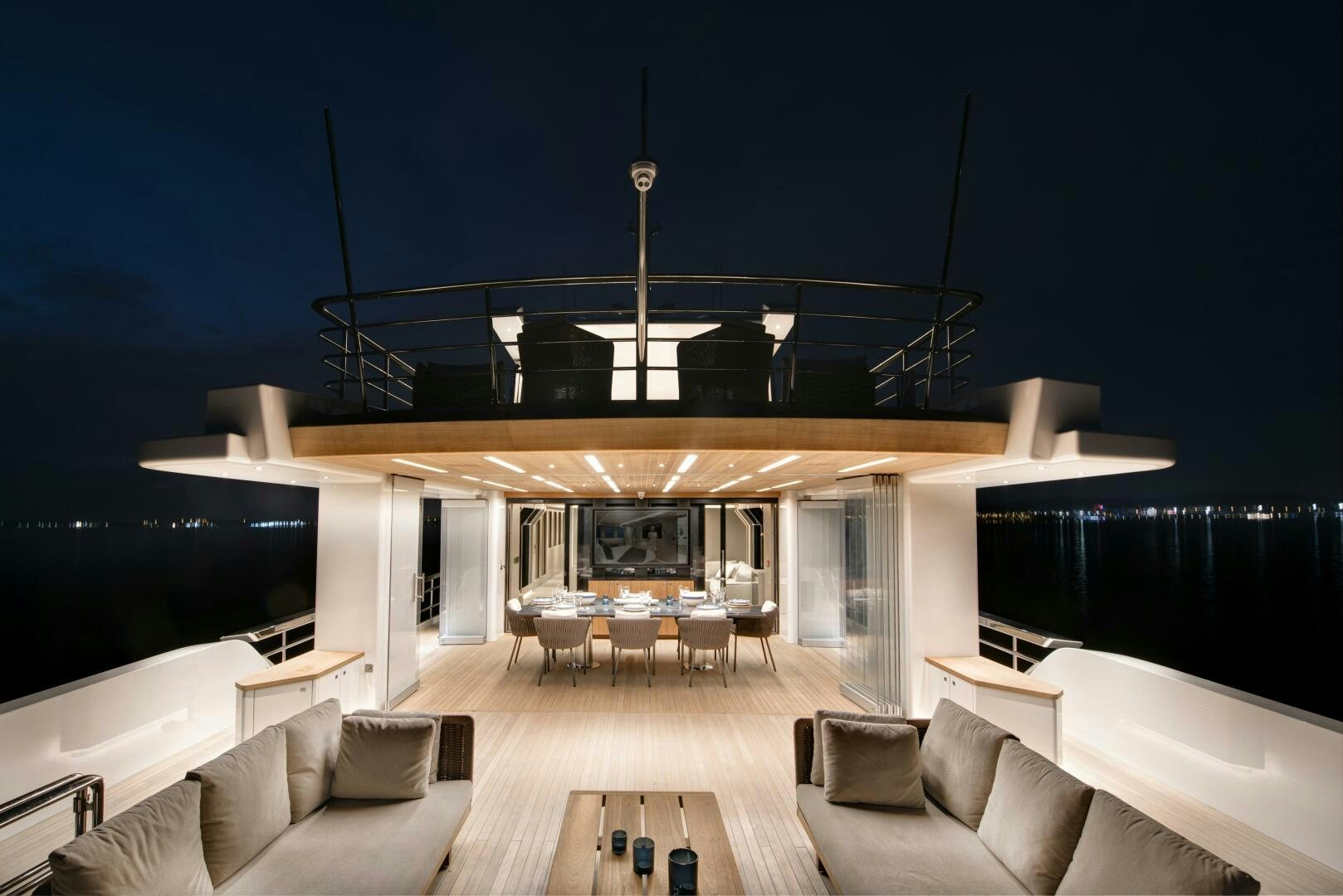 a modern living room with a fireplace aboard PICCOLO Yacht for Sale