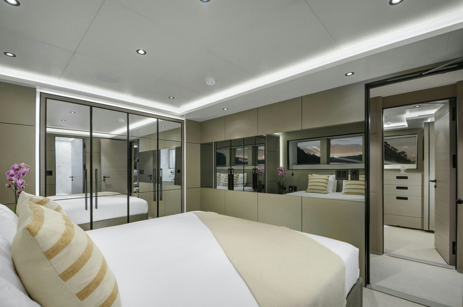 a room with a bed and a large window aboard PICCOLO Yacht for Sale