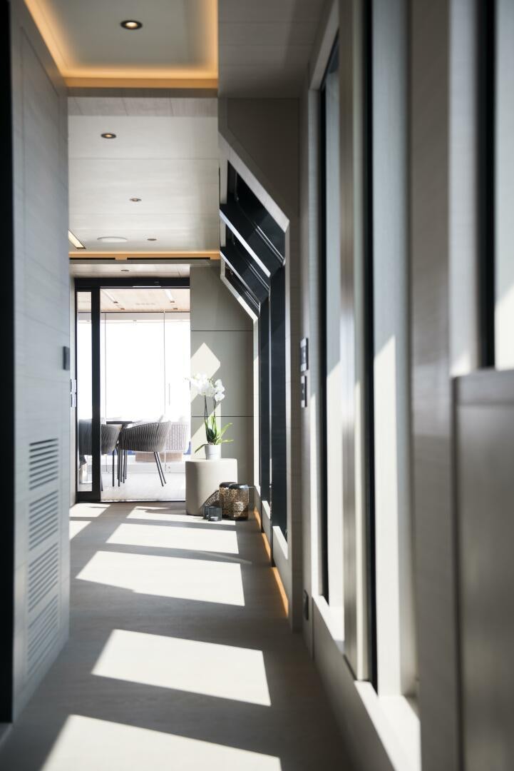 a hallway with a black and white floor and a black and white wall aboard PICCOLO Yacht for Sale