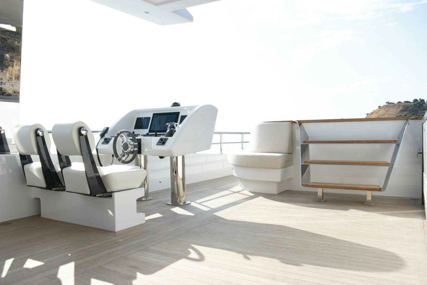 a white car parked in a room aboard PICCOLO Yacht for Sale