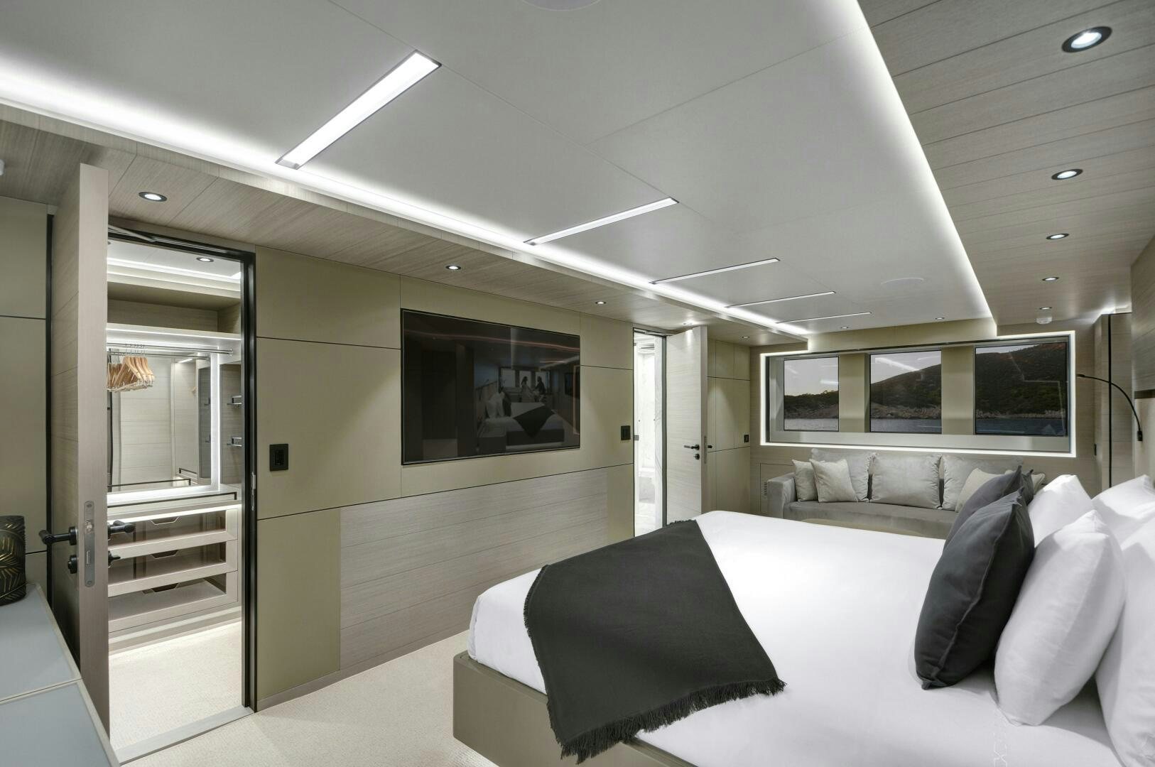 a room with a bed and a television aboard PICCOLO Yacht for Sale