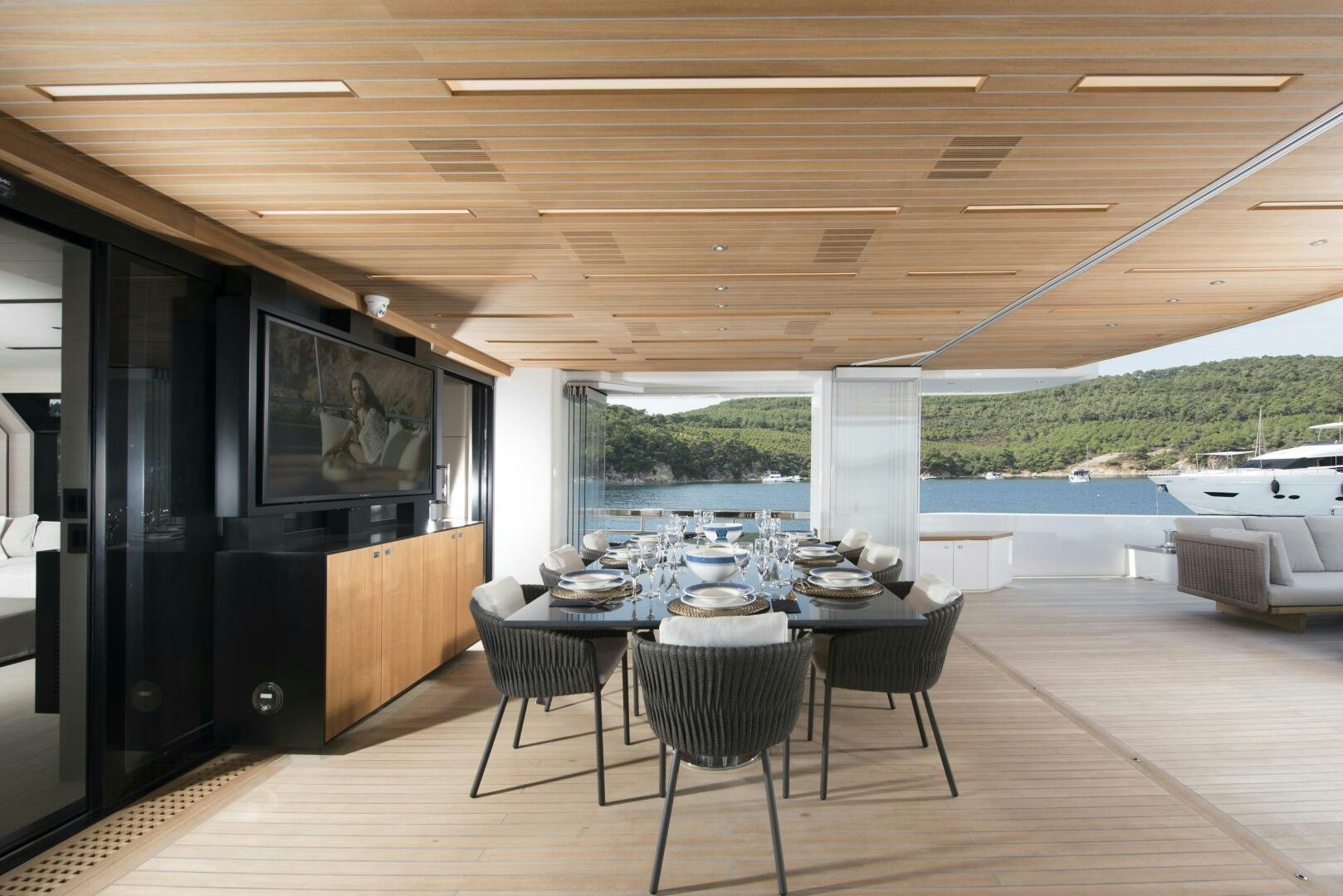 a room with a table and chairs aboard PICCOLO Yacht for Sale