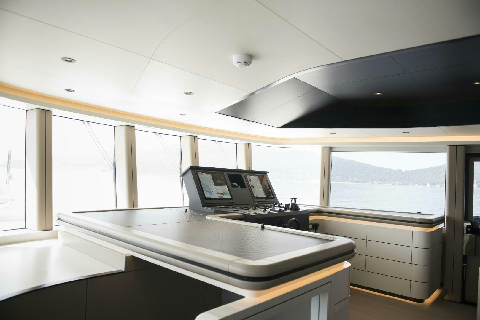 a laptop on a counter aboard PICCOLO Yacht for Sale