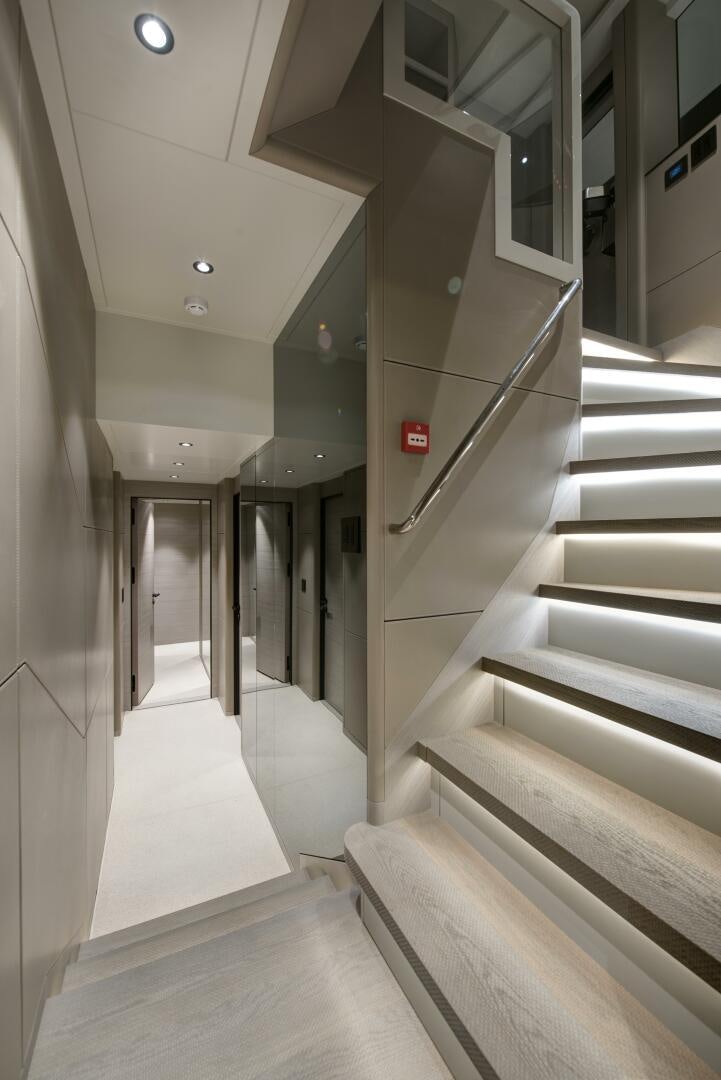 a hallway with white walls aboard PICCOLO Yacht for Sale