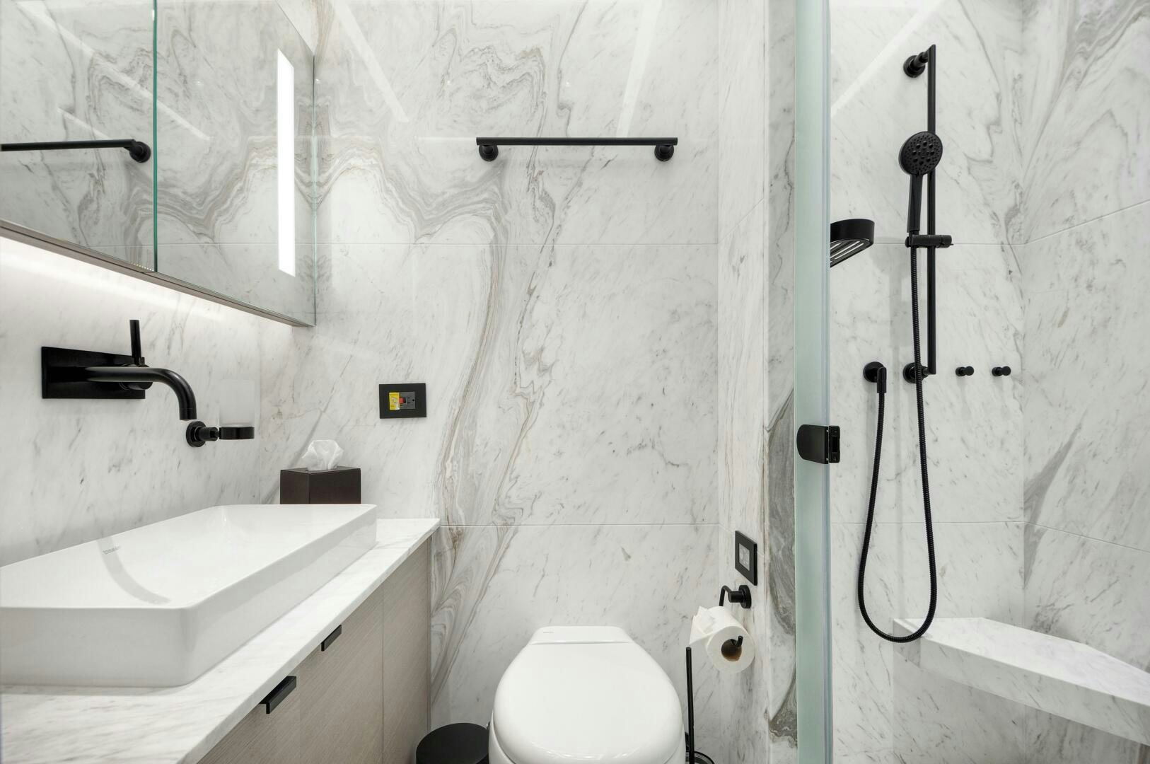 a bathroom with a sink and toilet aboard PICCOLO Yacht for Sale