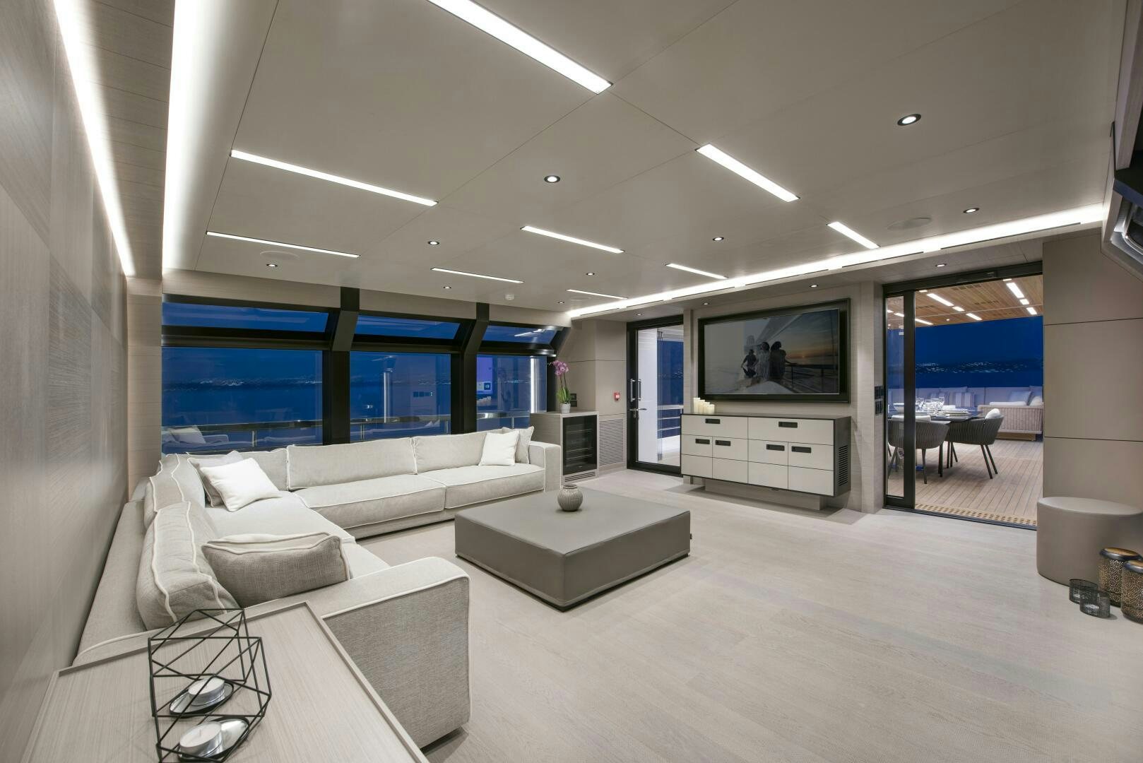 a room with a couch and a tv aboard PICCOLO Yacht for Sale