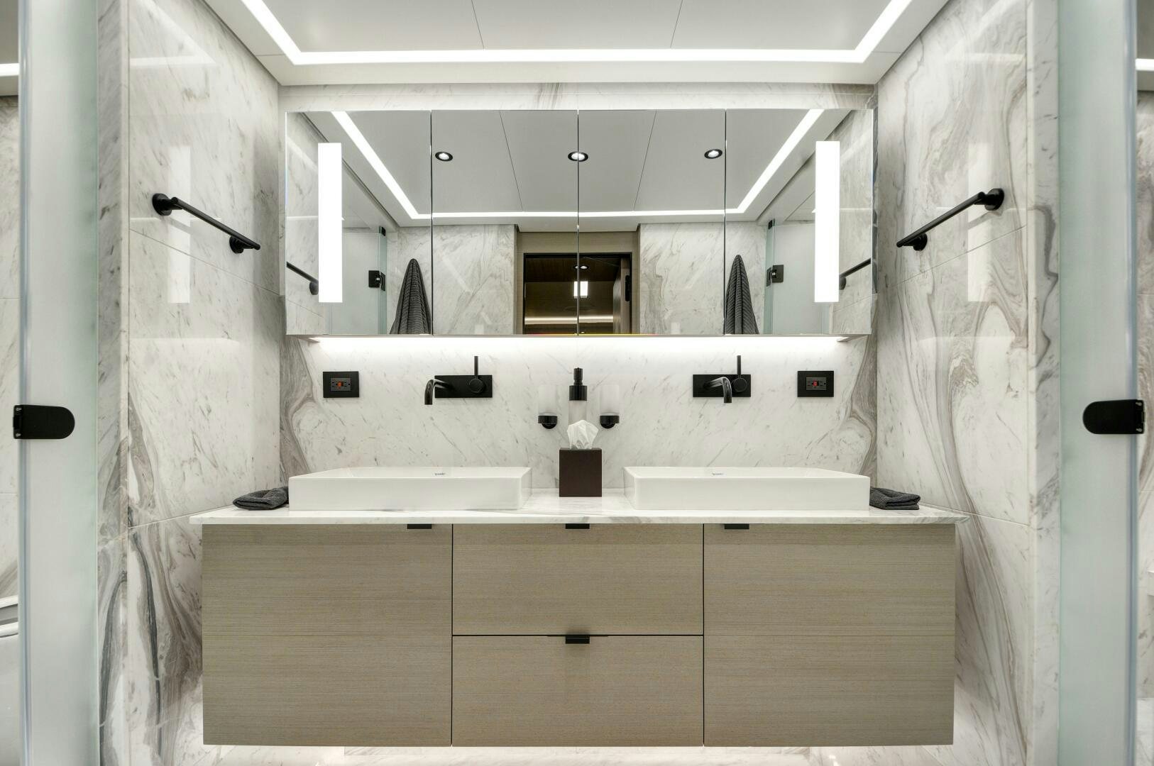 a bathroom with a sink and shower aboard PICCOLO Yacht for Sale