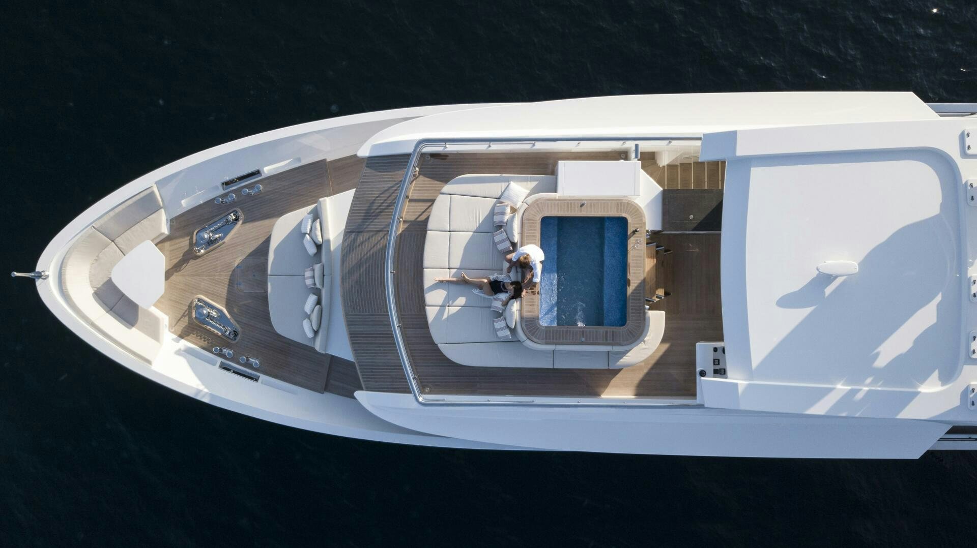 a person sitting in a chair on a plane aboard PICCOLO Yacht for Sale