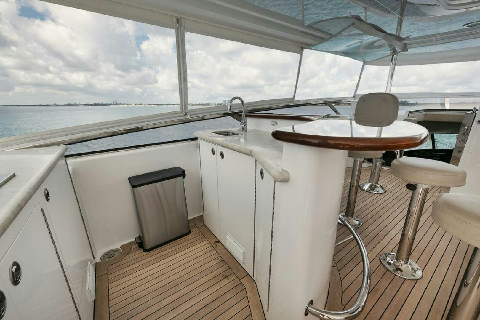 a kitchen with a table and chairs aboard NATURAL 9 X KALEEN Yacht for Sale