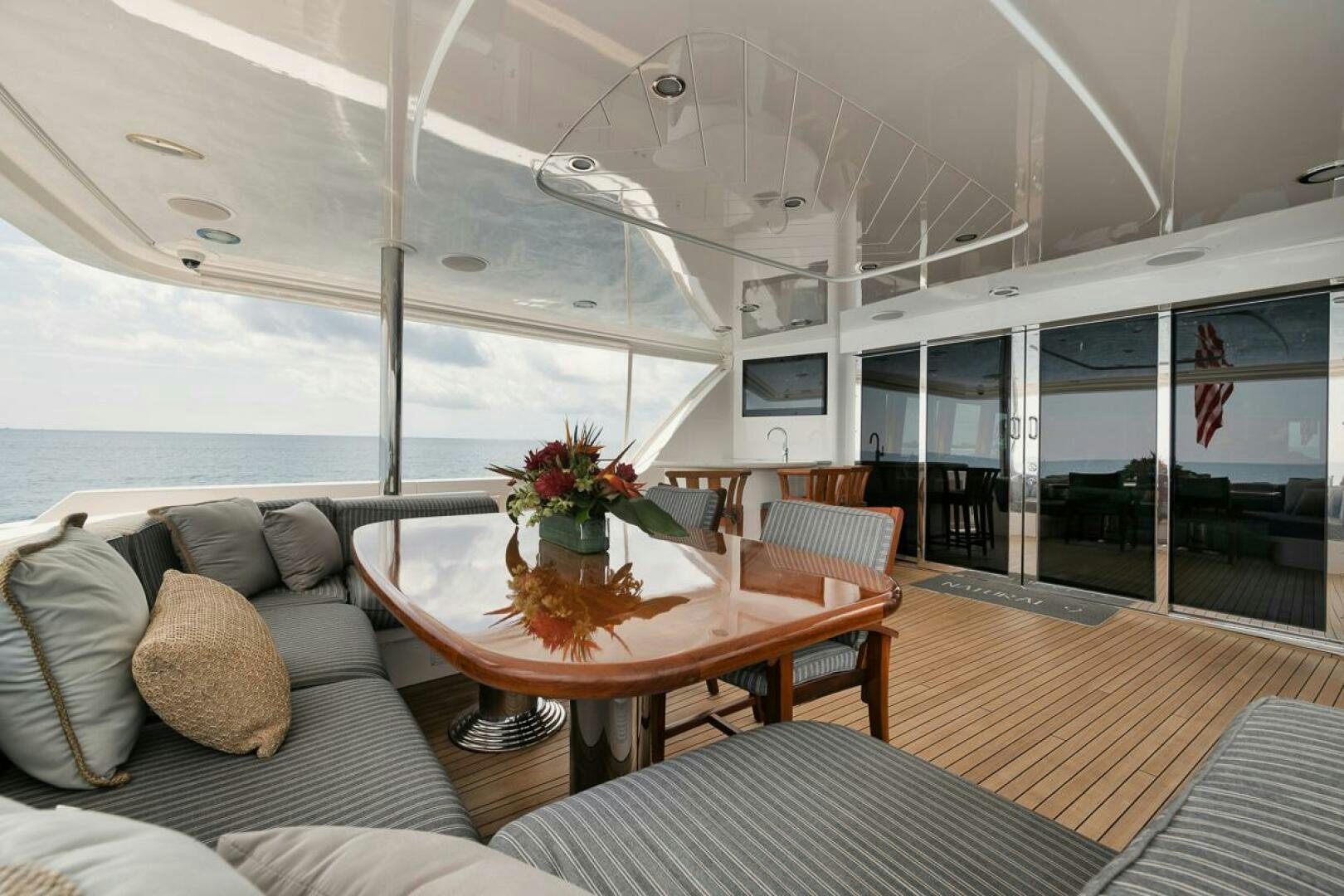 a large living room with a large balcony aboard NATURAL 9 X KALEEN Yacht for Sale