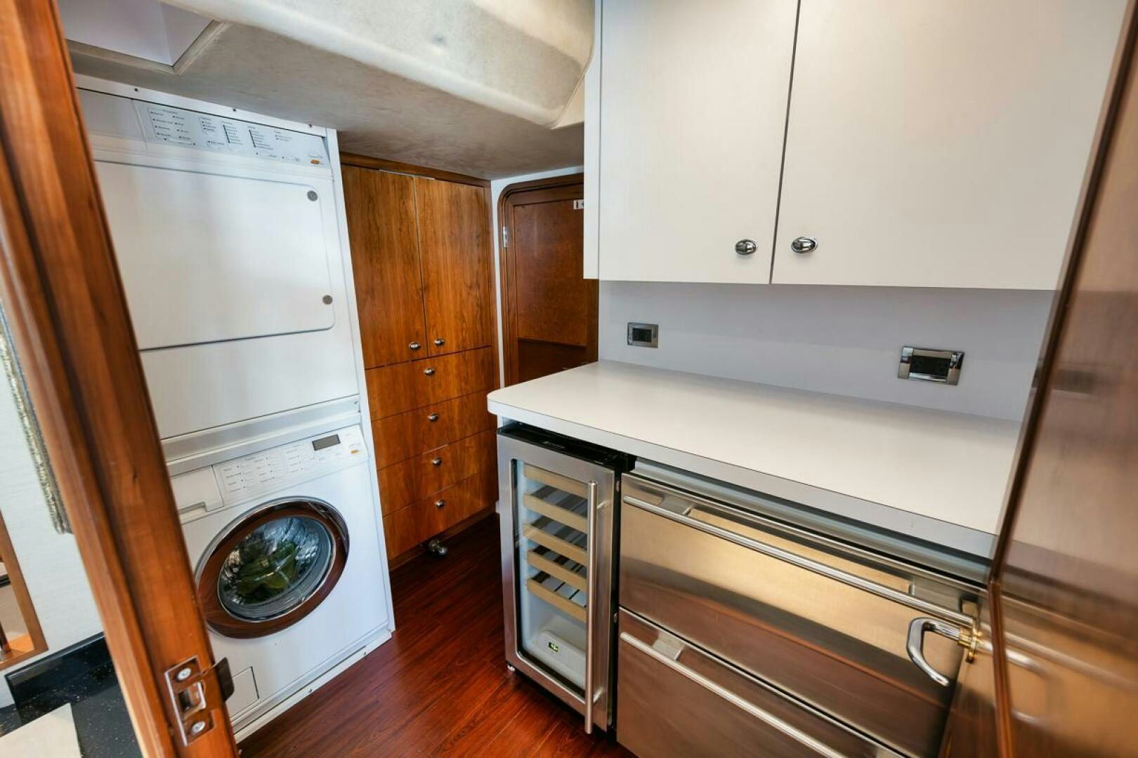 a kitchen with a washing machine aboard NATURAL 9 X KALEEN Yacht for Sale