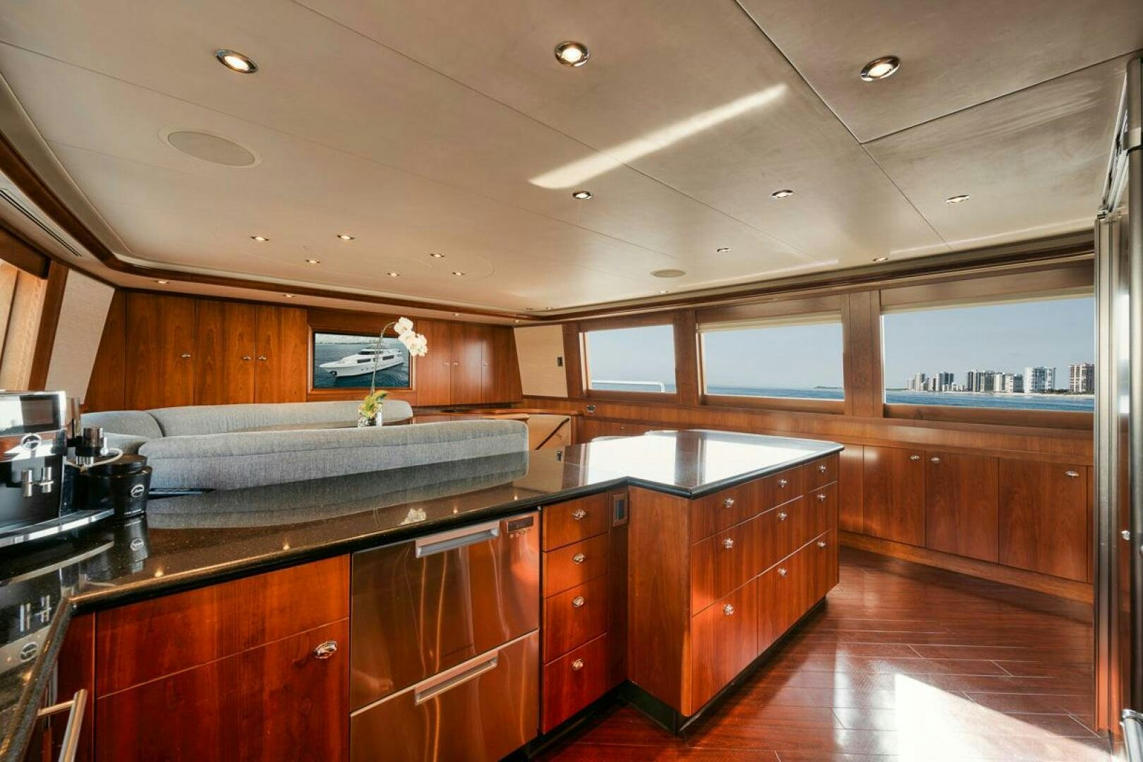 a kitchen with wooden cabinets aboard NATURAL 9 X KALEEN Yacht for Sale