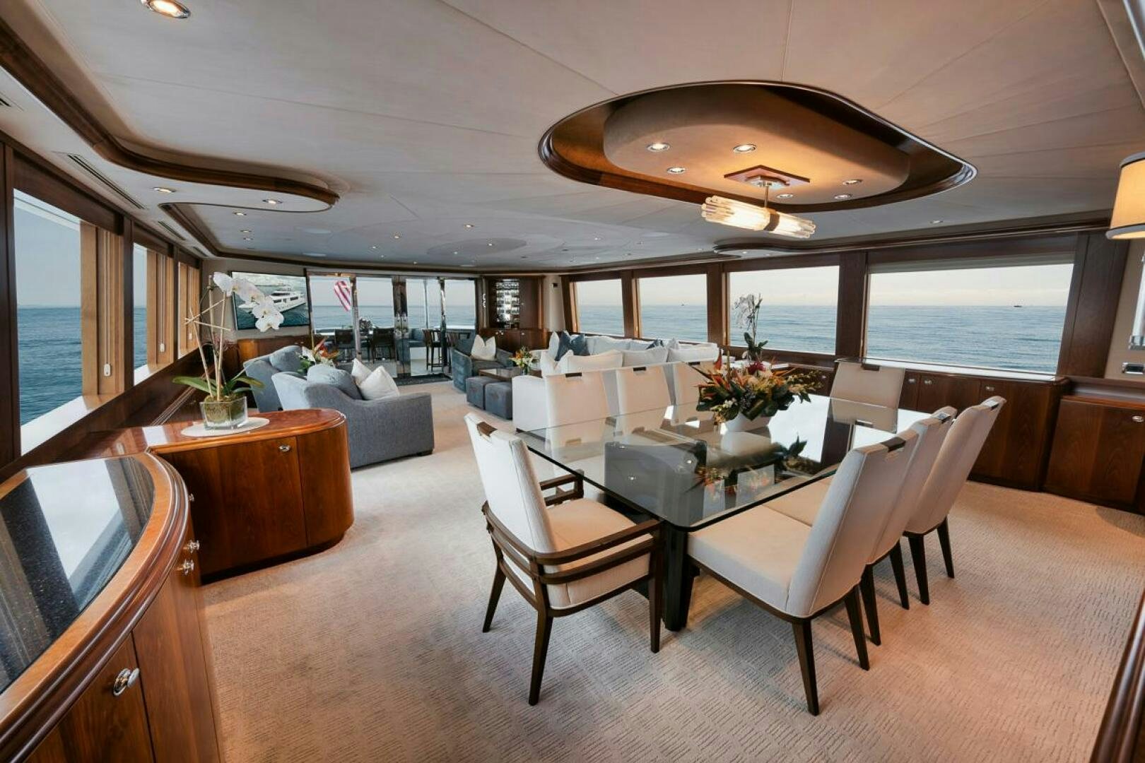 a room with a table chairs and a couch aboard NATURAL 9 X KALEEN Yacht for Sale