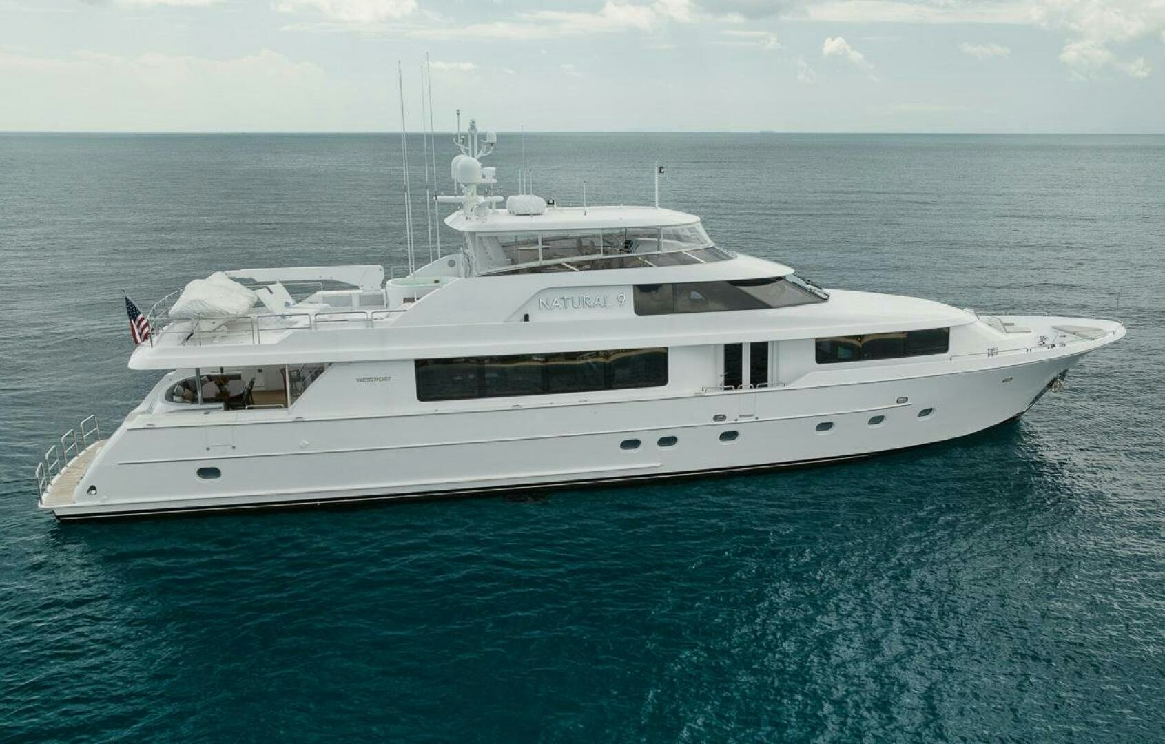 a white yacht in the water aboard NATURAL 9 X KALEEN Yacht for Sale