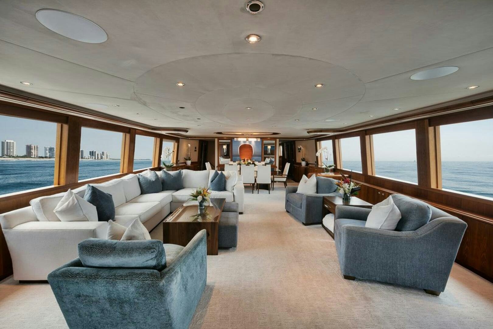 a living room with a large window aboard NATURAL 9 X KALEEN Yacht for Sale