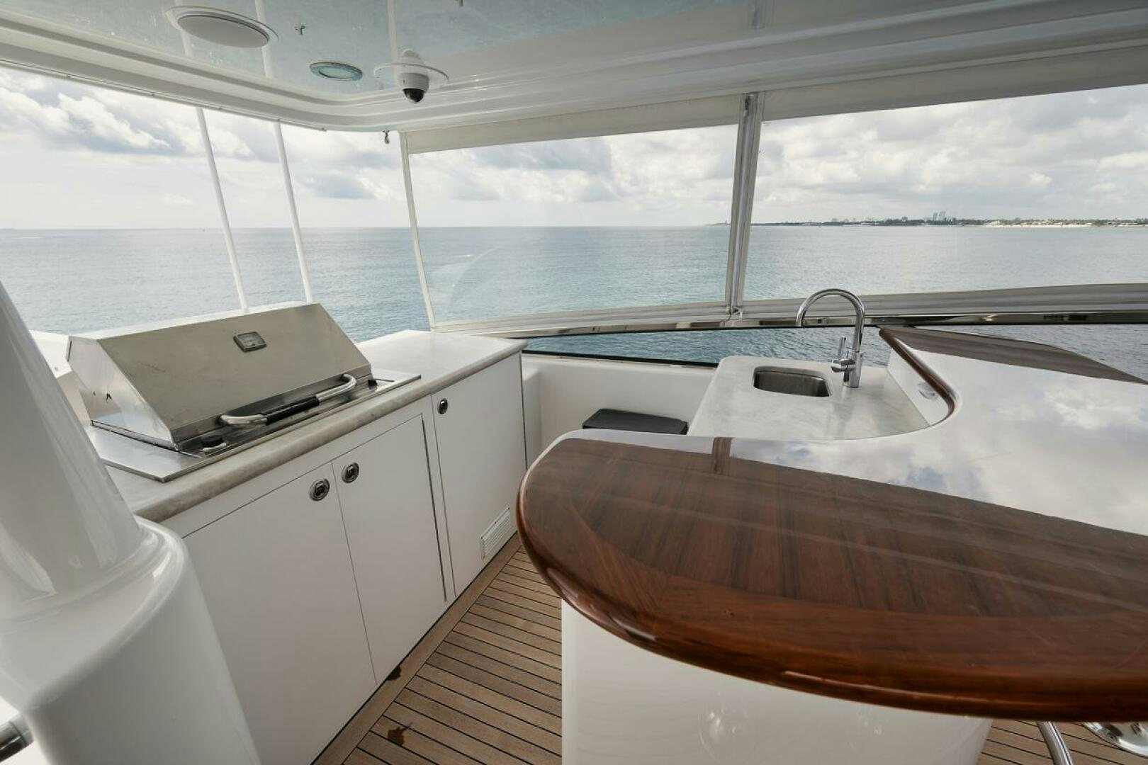 a kitchen with a sink and a large window aboard NATURAL 9 X KALEEN Yacht for Sale