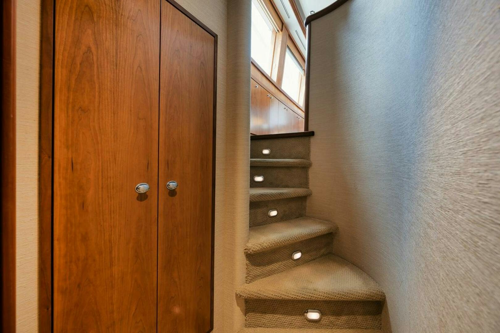 a wooden door with a wood cabinet aboard NATURAL 9 X KALEEN Yacht for Sale