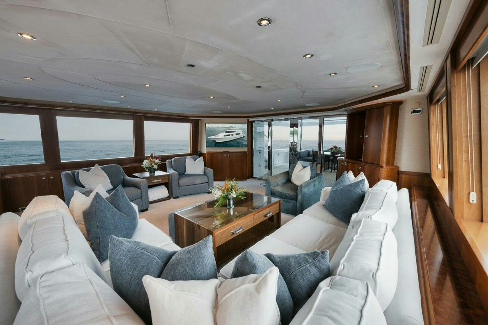 a living room with a large window aboard NATURAL 9 X KALEEN Yacht for Sale