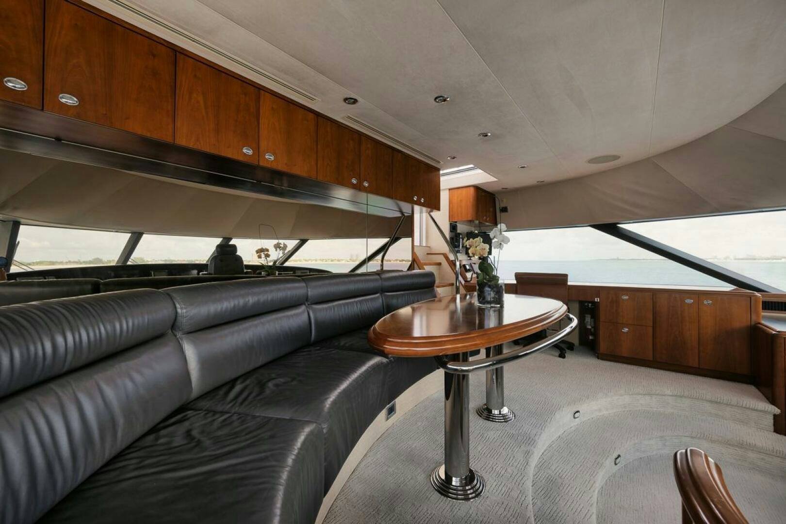 a living room with a leather couch aboard NATURAL 9 X KALEEN Yacht for Sale