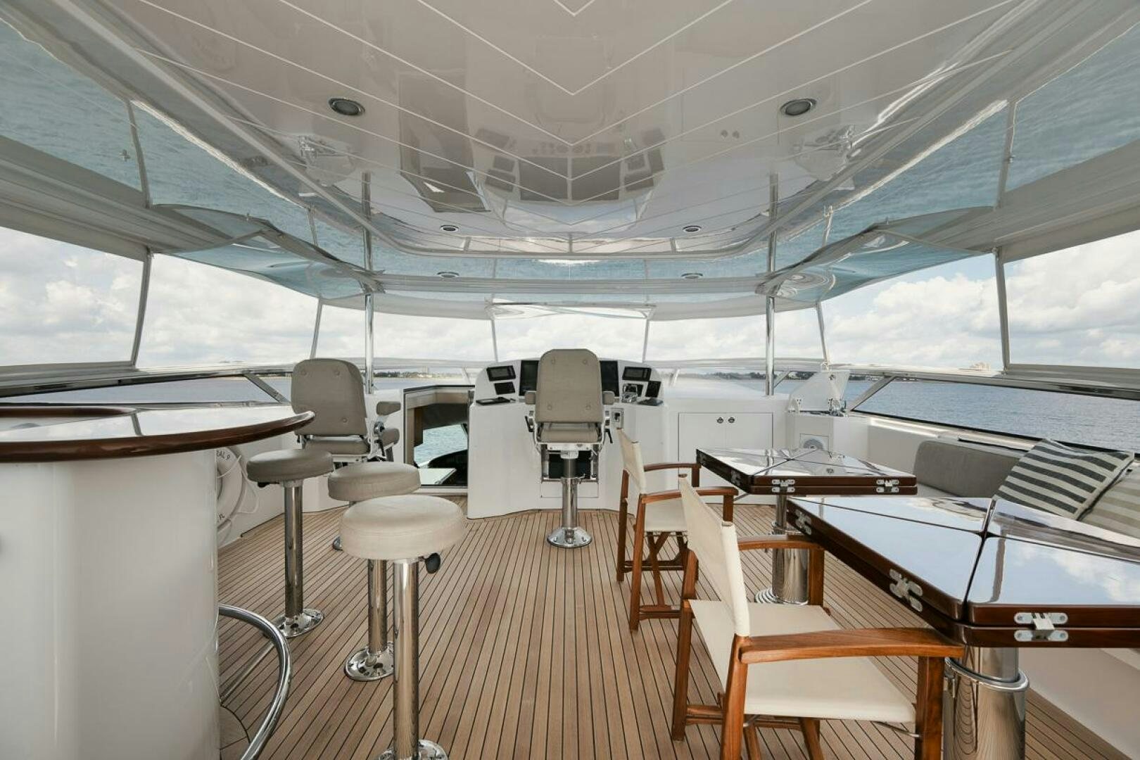 a room with tables and chairs aboard NATURAL 9 X KALEEN Yacht for Sale