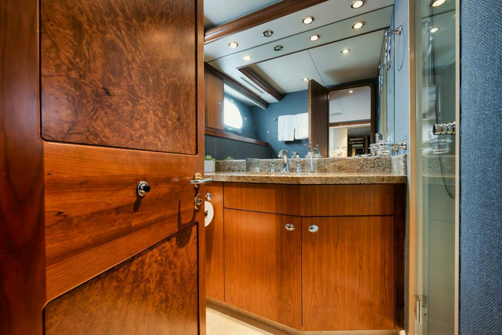 a bathroom with a countertop sink and cabinets aboard NATURAL 9 X KALEEN Yacht for Sale