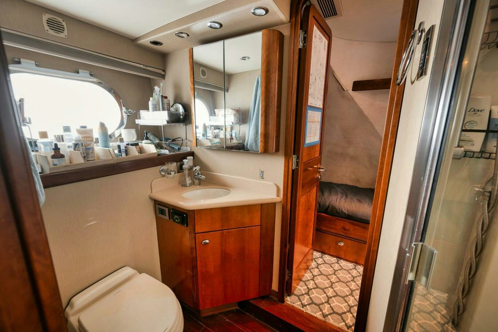 a bathroom with a sink and a mirror aboard NATURAL 9 X KALEEN Yacht for Sale