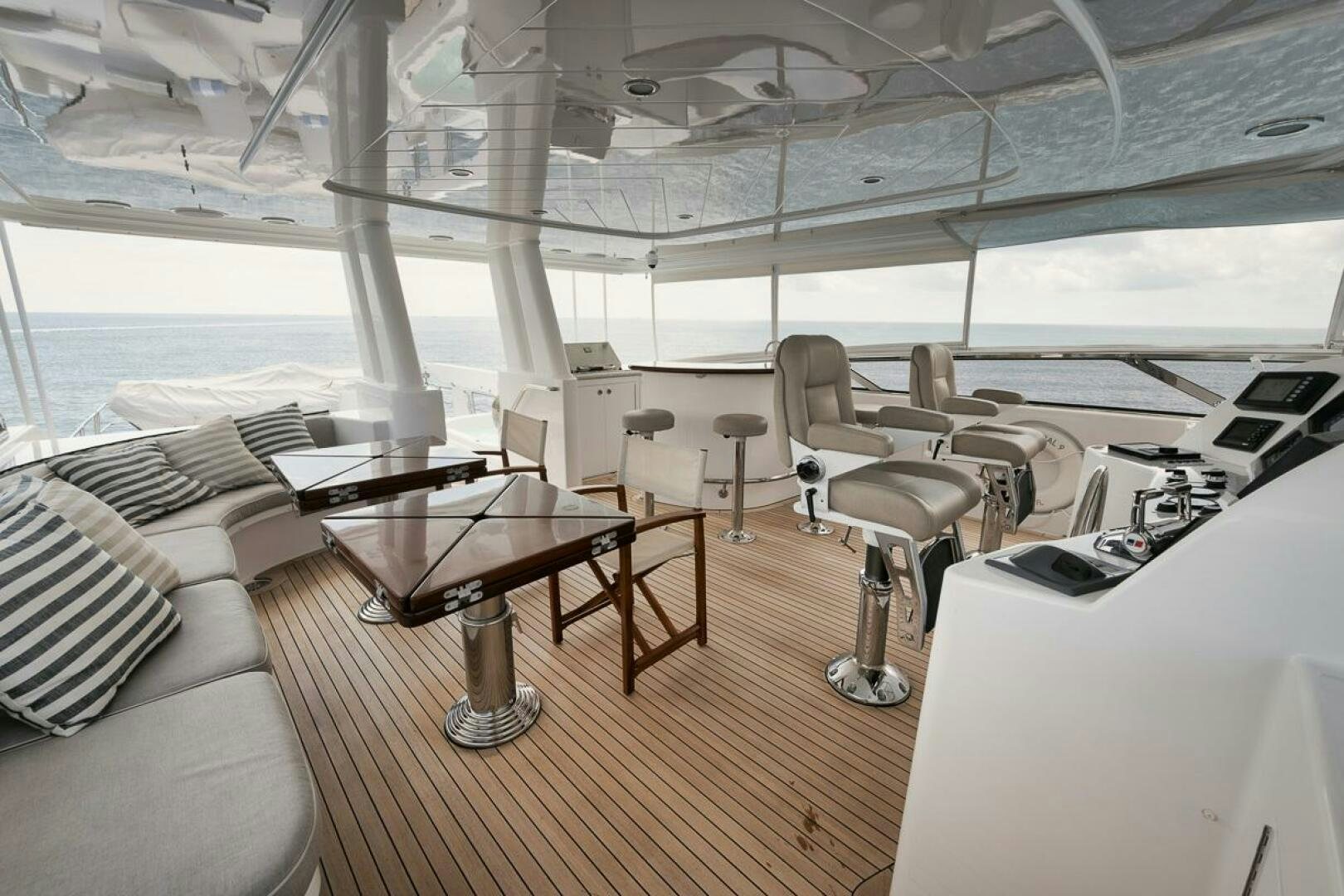 a room with a table and chairs aboard NATURAL 9 X KALEEN Yacht for Sale