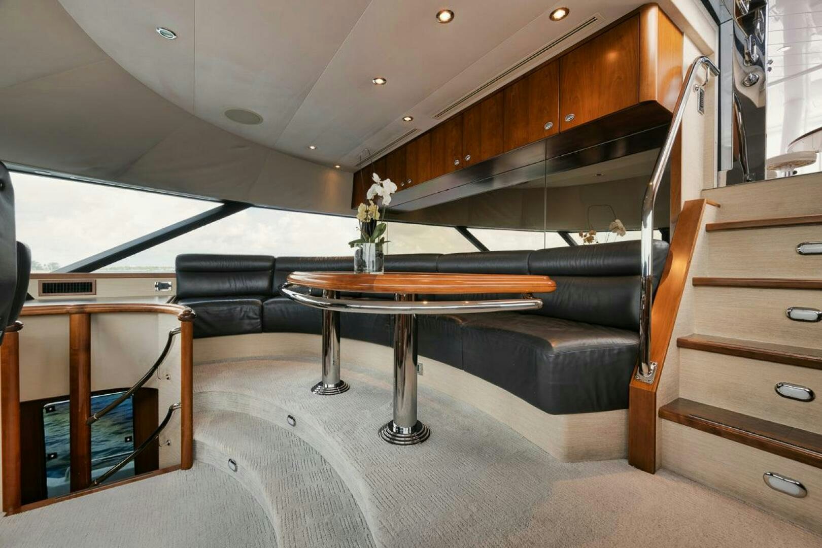 a room with a table and a bench aboard NATURAL 9 X KALEEN Yacht for Sale