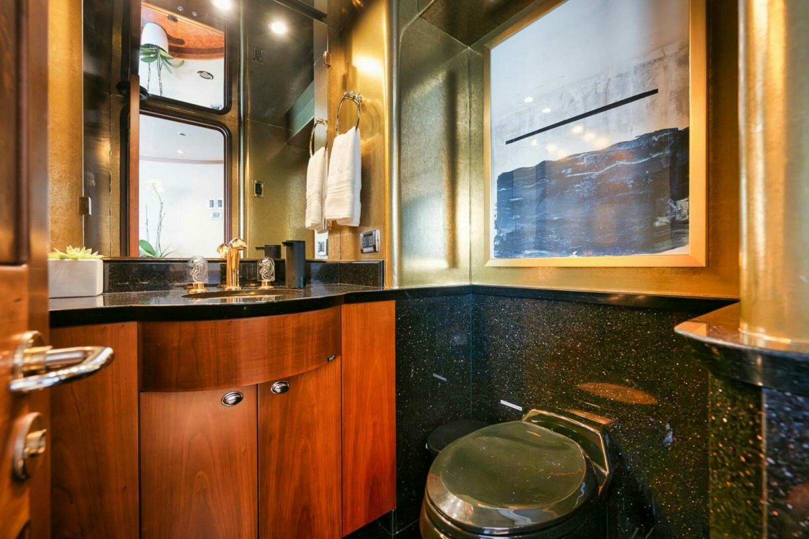 a bathroom with a sink and a mirror aboard NATURAL 9 X KALEEN Yacht for Sale