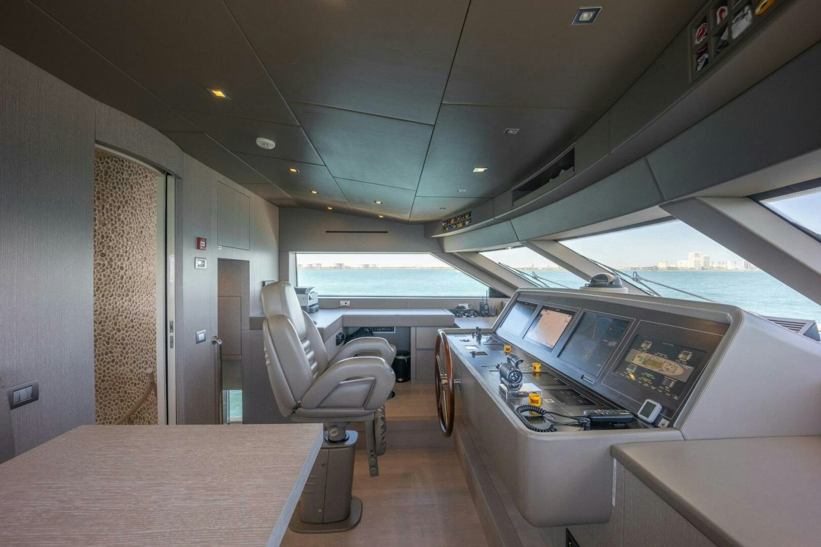 a room with a table and chairs aboard PHOENIX Yacht for Sale