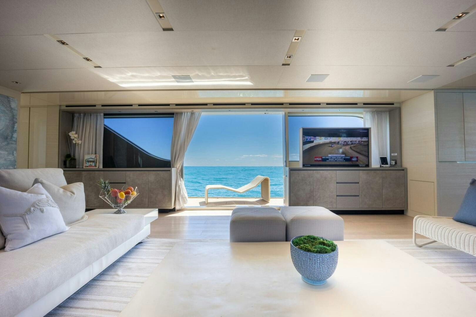 a living room with a large window aboard PHOENIX Yacht for Sale